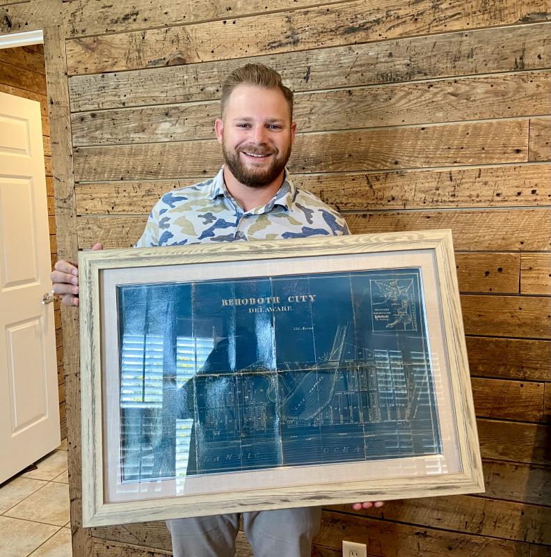 Jack Redefer, whose ancestors helped create Rehoboth by the Sea, said his father, former Mayor TJ Redefer, found an original Rehoboth City map in his grandfather’s jacket pocket. It now hangs framed in Jack’s office at Rehoboth Bay Realty. ELLEN DRISCOLL PHOTO